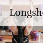 woman in black tank top and black shorts doing yoga