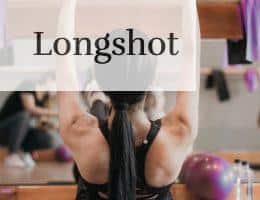 woman in black tank top and black shorts doing yoga
