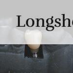 white candle on black textile