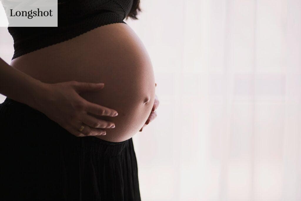 woman holding stomach