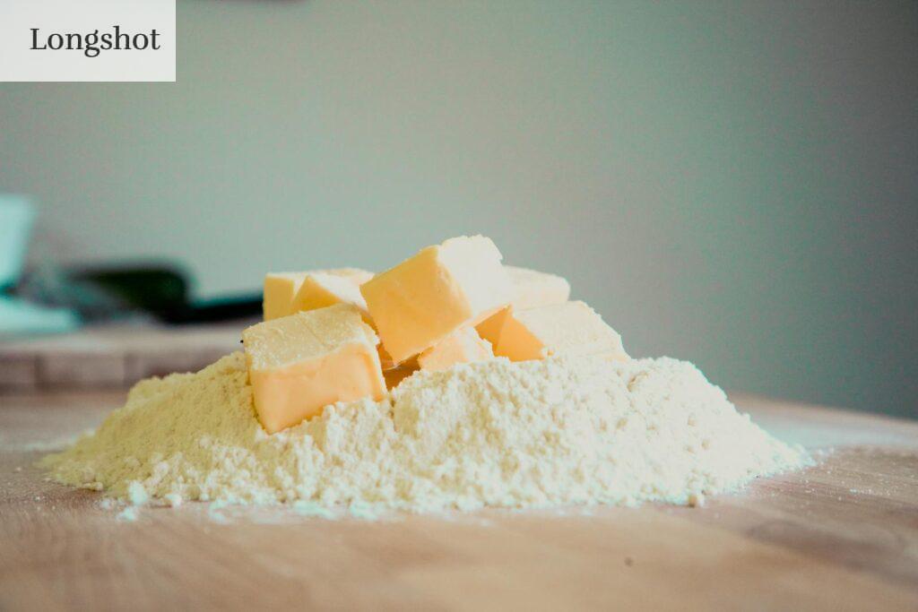 Close-up of butter and flour on a kitchen counter, perfect for baking.