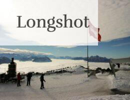 Majestic snowy view from Rigi Kulm, Switzerland, with Swiss flag and mountains.