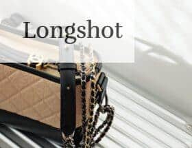 brown and black leather sling bag