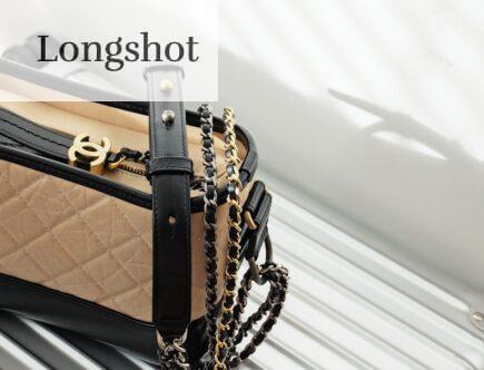 brown and black leather sling bag