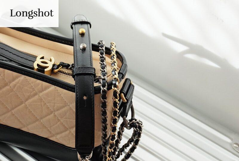 brown and black leather sling bag