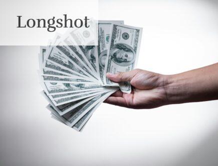 person holding 100 US Dollar banknote