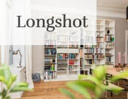 white wooden book shelves on brown wooden parquet floor