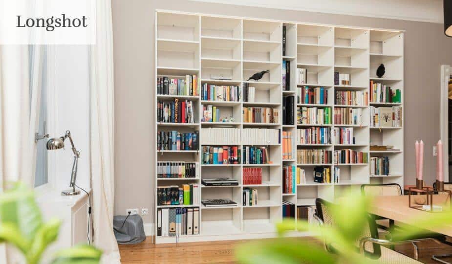 white wooden book shelves on brown wooden parquet floor